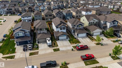 Residential streetscape featuring a collection of detached homes with varied architectural styles - 41 Sequoia Bend, Fort Saskatchewan, AB 