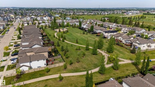 Expansive community green space with meandering pathways and mature trees - 41 Sequoia Bend, Fort Saskatchewan, AB 