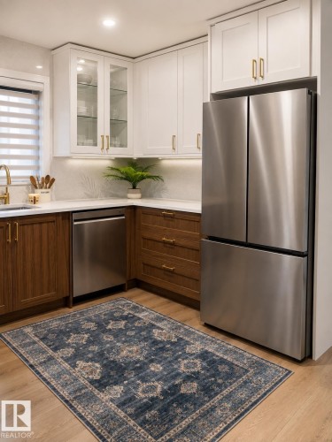Recessed lighting, wood-finish flooring, stainless steel appliances, two-tone cabinetry, and a white tile backsplash - 3830 22 Street Nw, Edmonton, AB 