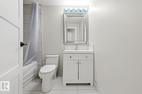 White paneled door with matte black hardware - 3830 22 Street Nw, Edmonton, AB 