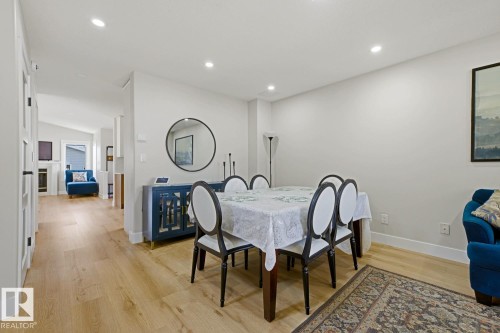 Recessed lighting illuminating light wood-finish flooring - 3830 22 Street Nw, Edmonton, AB 