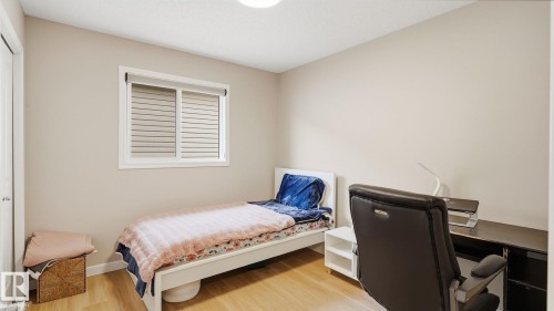 Light wood-finish flooring, white trim, and neutral wall paint - 4610 Westcliff Point(E) Sw, Edmonton, AB 