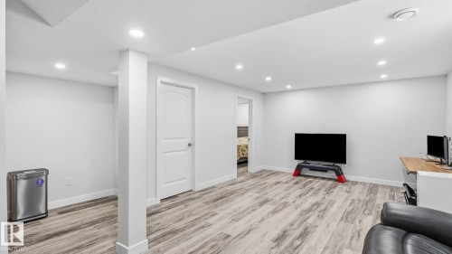 Recessed lighting illumination, wood-finish flooring, and white interior doors - 4610 Westcliff Point(E) Sw, Edmonton, AB 