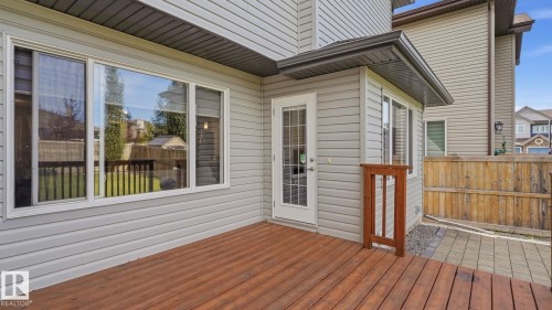 Expansive wood-finish deck with privacy fencing and a paver stone patio - 4610 Westcliff Point(E) Sw, Edmonton, AB 