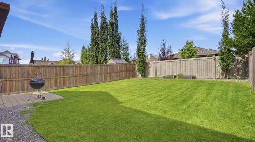 Expansive lawn area, full perimeter wood fencing, and a paved patio area - 4610 Westcliff Point(E) Sw, Edmonton, AB 