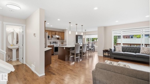 Open-concept living area with wood-finish flooring - 4610 Westcliff Point(E) Sw, Edmonton, AB 
