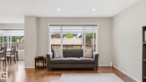 Recessed lighting, wood-finish flooring, large windows, and a built-in bookshelf - 4610 Westcliff Point(E) Sw, Edmonton, AB 