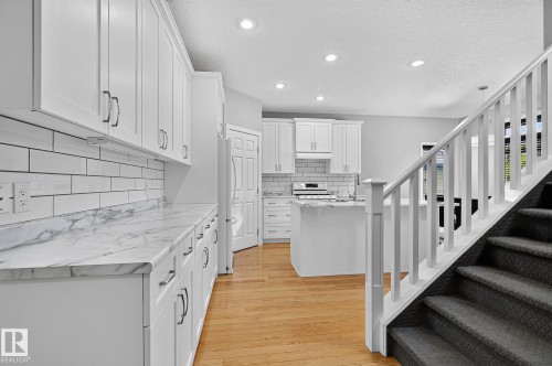 Plenty of cabinets, tile backsplash, Island - 5 Verona Crescent, Spruce Grove, AB 