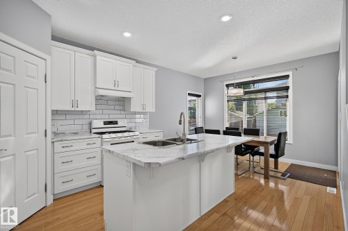 Kitchen and dining room, door to the deck - 5 Verona Crescent, Spruce Grove, AB 