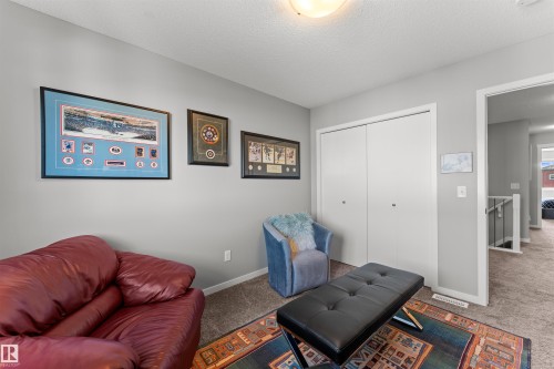 Recessed overhead lighting, light gray wall paint, white trim, carpeted flooring, and a double bi-fold closet - 12218 176 Avenue Nw, Edmonton, AB 