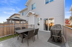 Rear deck with composite decking, aluminum railing, and a sliding glass door - 
