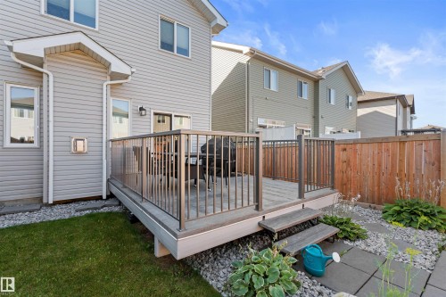 Rear deck with composite decking and metal railings - 12218 176 Avenue Nw, Edmonton, AB 