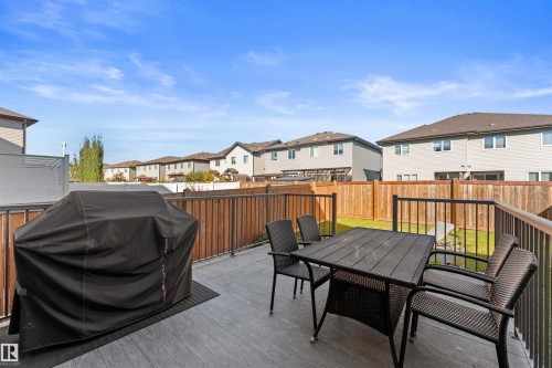 Expansive deck with composite decking and dark metal railings - 12218 176 Avenue Nw, Edmonton, AB 