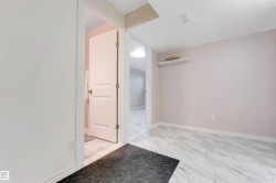 Light-toned wall finishes, white trim, and white wood-finish doors - 