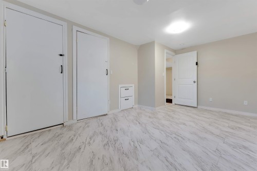 Neutral wall paint, light-colored flooring, recessed lighting, and built-in drawer storage - 1124 37A Avenue Nw, Edmonton, AB 