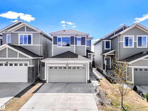Attached two-car garage with a concrete driveway - 2435 12 Avenue Nw, Edmonton, AB 