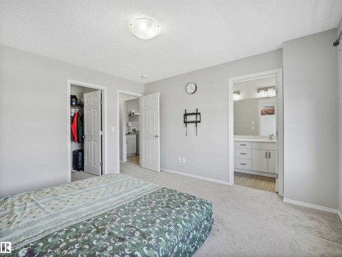 Recessed ceiling light, carpeted flooring, white trim, and white doors - 2435 12 Avenue Nw, Edmonton, AB 