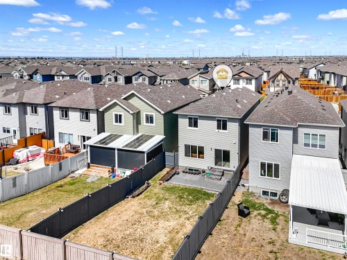 Fenced backyard featuring a paver patio and a covered deck - 2435 12 Avenue Nw, Edmonton, AB 