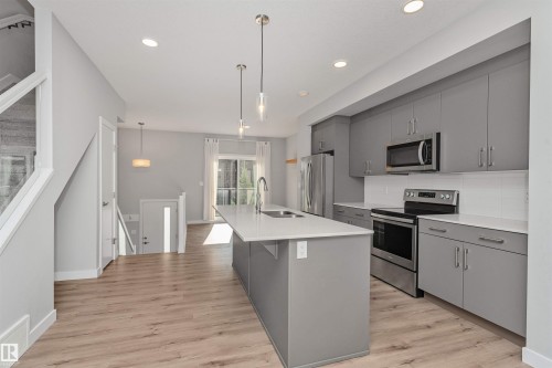 #17 1729 Keene Cr Sw, Edmonton, AB - Indoor Photo Showing Kitchen With Double Sink With Upgraded Kitchen