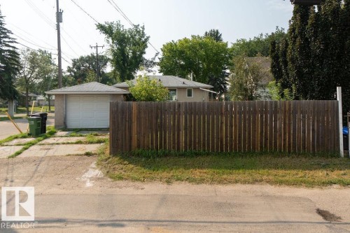 Detached garage structure with a pitched roof and a white garage door - 12303 131 St Nw Nw, Edmonton, AB 