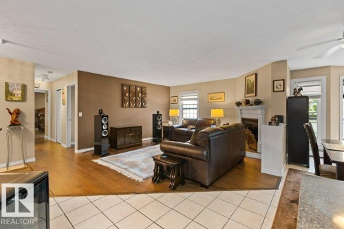 #307 3 Perron St, St. Albert, AB - Indoor Photo Showing Living Room With Fireplace