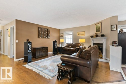 #307 3 Perron St, St. Albert, AB - Indoor Photo Showing Living Room With Fireplace