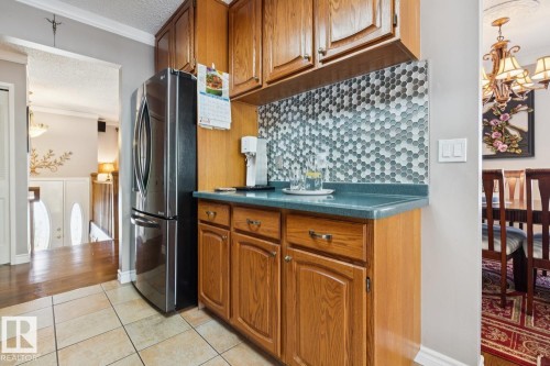 Kitchen features a breakfast nook - 14243 24 Street Nw, Edmonton, AB 