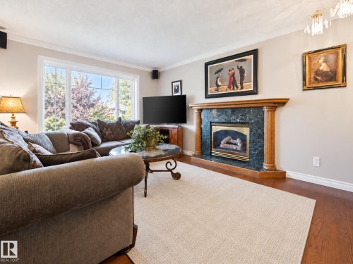 features hardwood floors and gas fireplace - 14243 24 Street Nw, Edmonton, AB 