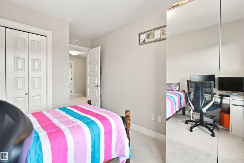 Carpeted flooring, white trim, recessed lighting, and white paneled doors - 8024 Orchards Green Green Sw, Edmonton, AB 