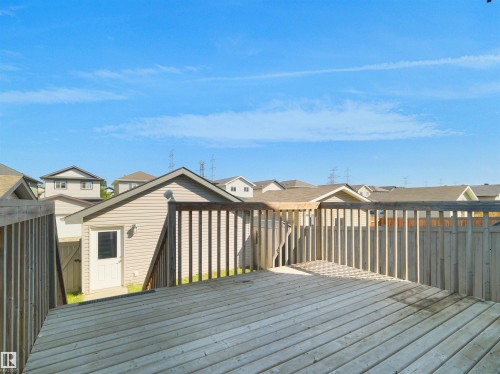 Wood deck featuring wood railing - 5190 1B Avenue Sw, Edmonton, AB 