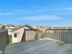 Wood deck featuring wood railing - 