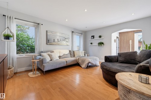 Recessed lighting, wood-finish flooring, arched entryway, and white floating shelves - 10726 128 Street Nw, Edmonton, AB 