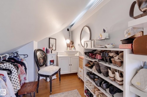 Sloped ceiling design with hardwood flooring - 10726 128 Street Nw, Edmonton, AB 