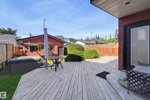 Expansive wood decking with integrated hot tub - 10726 128 Street Nw, Edmonton, AB 