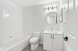 White vanity with a rectangular basin, chrome faucet, and matte black hardware - 