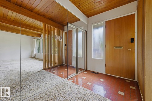 Wood-finish tongue and groove ceiling with exposed beams - 7508 139 Street Nw, Edmonton, AB 