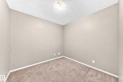 Neutral-toned walls complement the carpeted flooring - 
