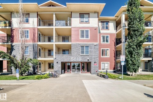 Multi-story building featuring stone veneer and horizontal siding - #218 5810 Mullen Pl Nw Nw, Edmonton, AB 