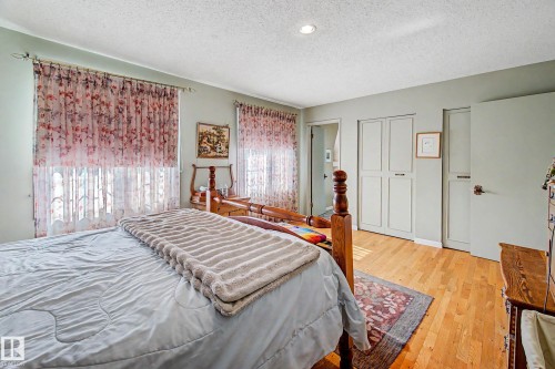 Hardwood flooring, recessed ceiling lighting, two sets of windows, and built-in closet storage - 36 Lodgepole Crescent, St. Albert, AB 