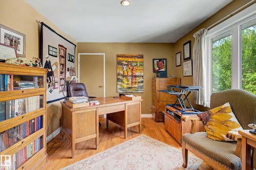 Recessed lighting, wood-finish flooring, a large window, and light-colored walls - 36 Lodgepole Crescent, St. Albert, AB 