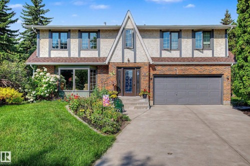 Brick and stucco exterior with a prominent A-frame architectural detail - 36 Lodgepole Crescent, St. Albert, AB 