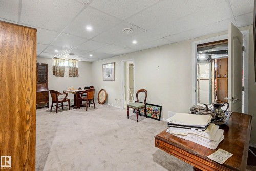 Recessed lighting illuminates the space, featuring light-colored walls and soft carpeting throughout - 36 Lodgepole Crescent, St. Albert, AB 