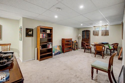 Recessed lighting illuminates a spacious room featuring a drop ceiling and light-toned wall paint - 36 Lodgepole Crescent, St. Albert, AB 