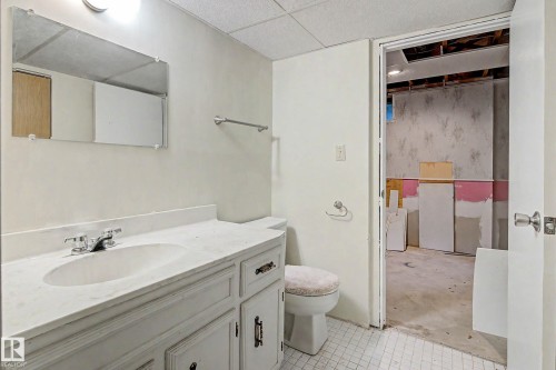 White vanity with an integrated sink and chrome faucet - 36 Lodgepole Crescent, St. Albert, AB 