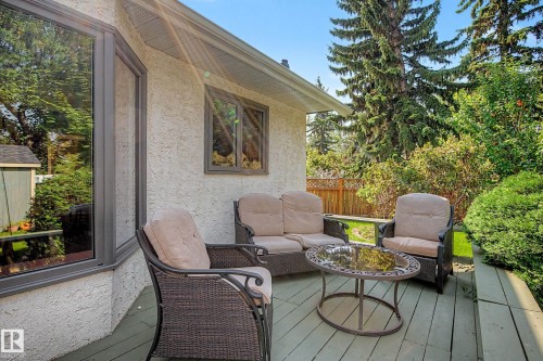 Deck with a wood finish, stucco exterior, and bay window - 36 Lodgepole Crescent, St. Albert, AB 