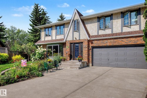 Brick and stucco exterior with gabled roofing, concrete driveway, attached garage, and mature landscaping - 36 Lodgepole Crescent, St. Albert, AB 