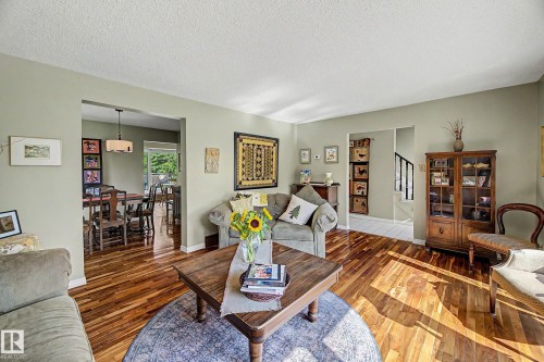 Wood-finish flooring throughout, with a recessed doorway opening to an additional space - 36 Lodgepole Crescent, St. Albert, AB 