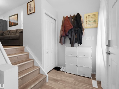 Wood-finish flooring throughout the entry and staircase - 15511 45 Street Nw, Edmonton, AB 