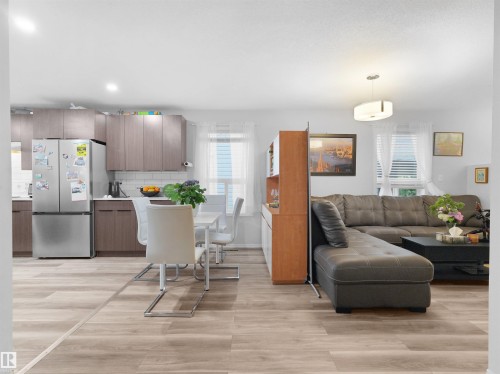 Open concept layout with wood-finish flooring - 15511 45 Street Nw, Edmonton, AB 