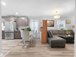 Open concept layout with wood-finish flooring - 